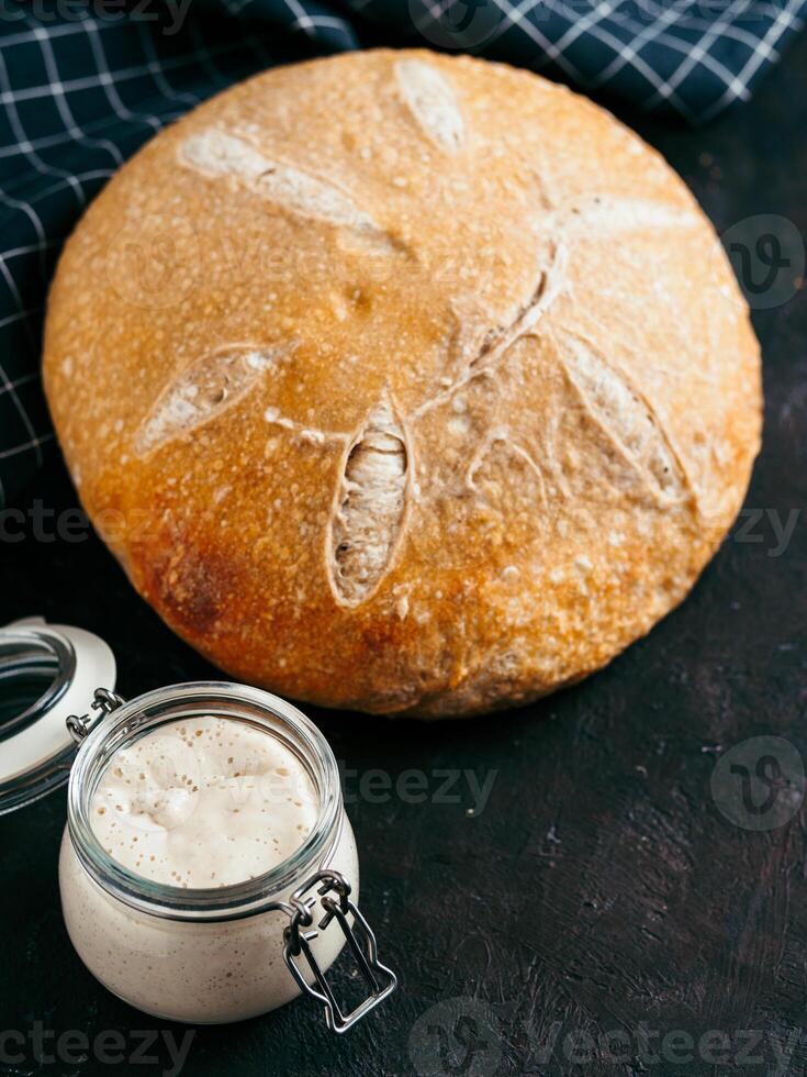 Wheat round sourdough bread, copy space, vertical photo