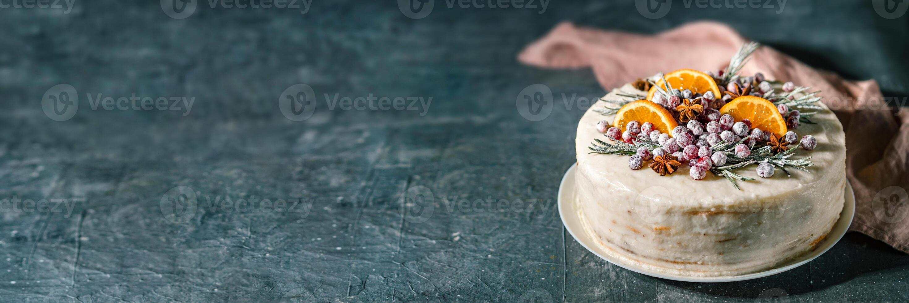 Cristmas cake decorated rosemary cranberries photo