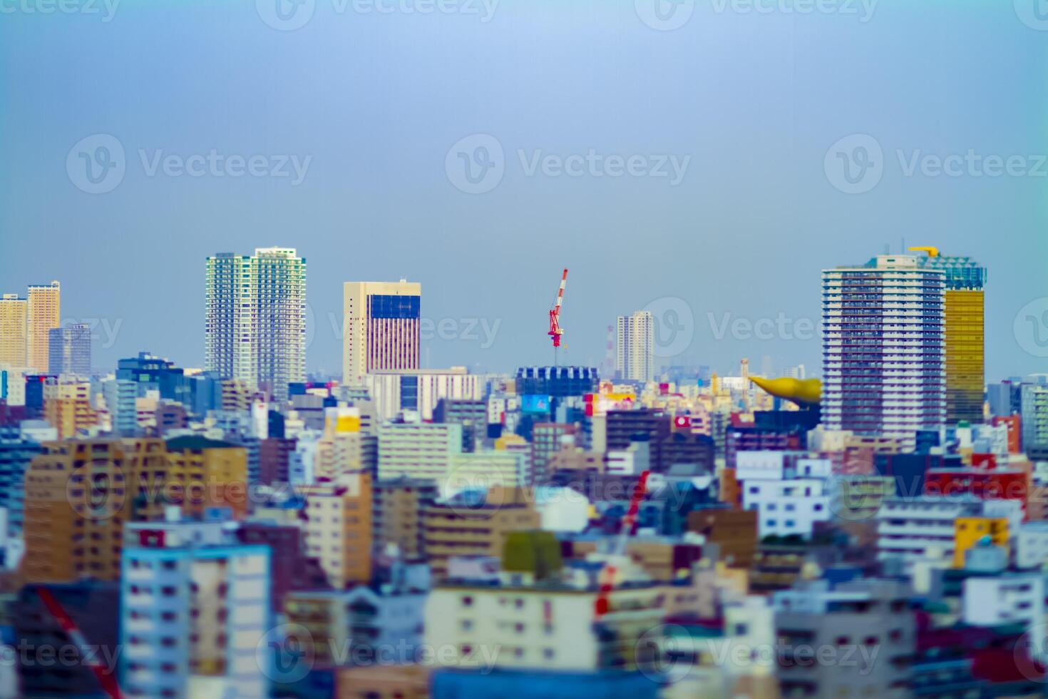 Crane at top of the building in Tokyo tiltshift photo
