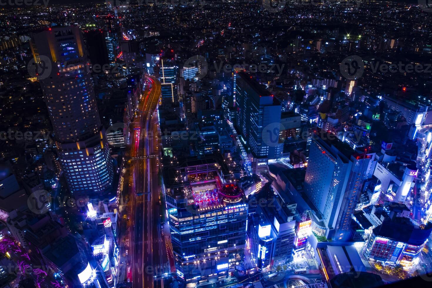 A night neon town in Shibuya Tokyo high angle wide shot photo