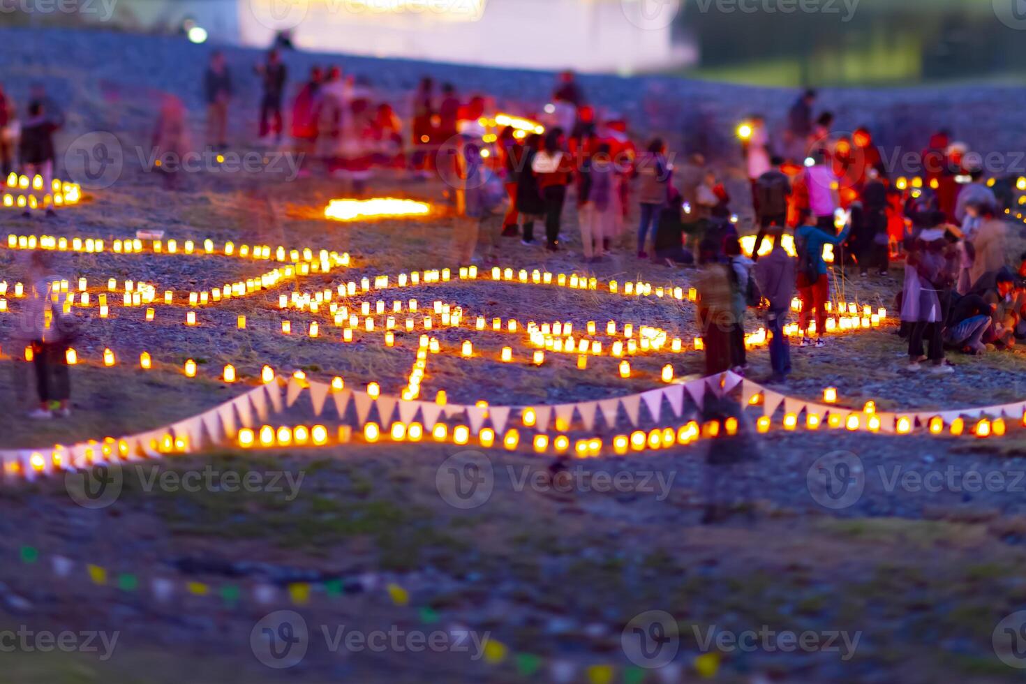 A burning romantic candles medium shot tiltshift at dusk photo