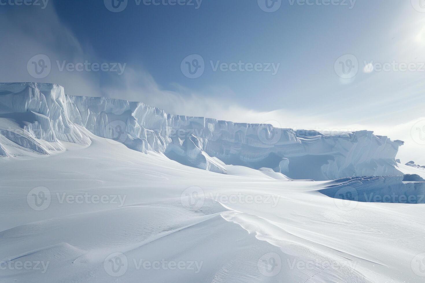 Snow drifting across an antarctic landscape with ice cliffs photo