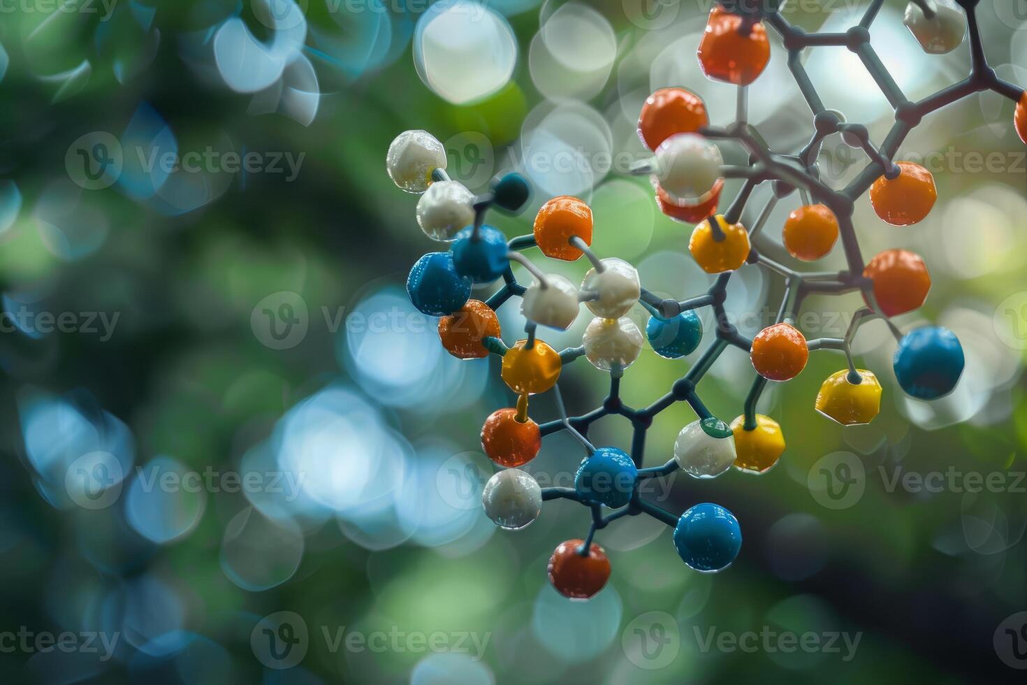 Molecular model hanging in front of a green background with bokeh photo