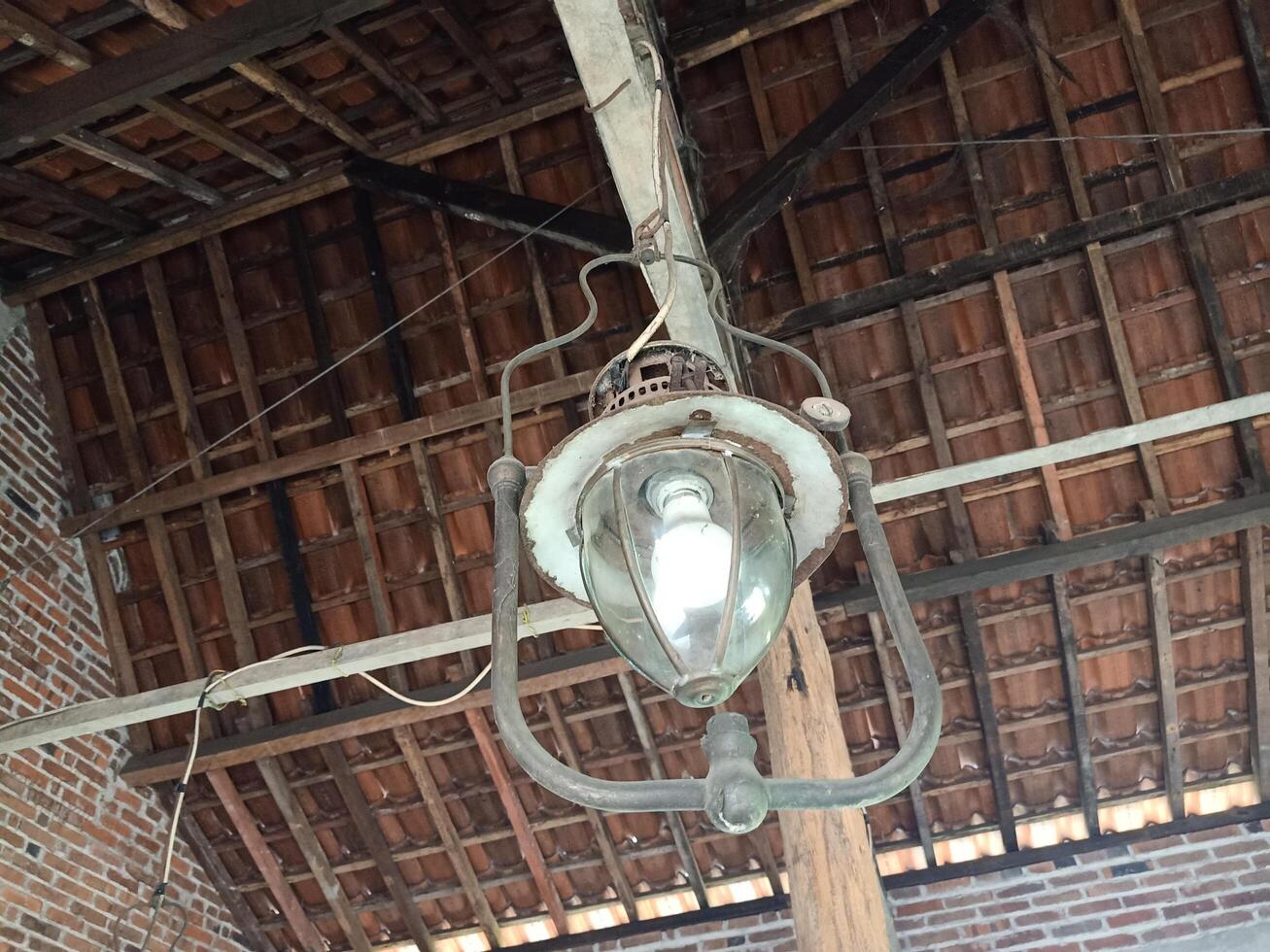an antique lamp, a strongking lamps that still hang in the house photo