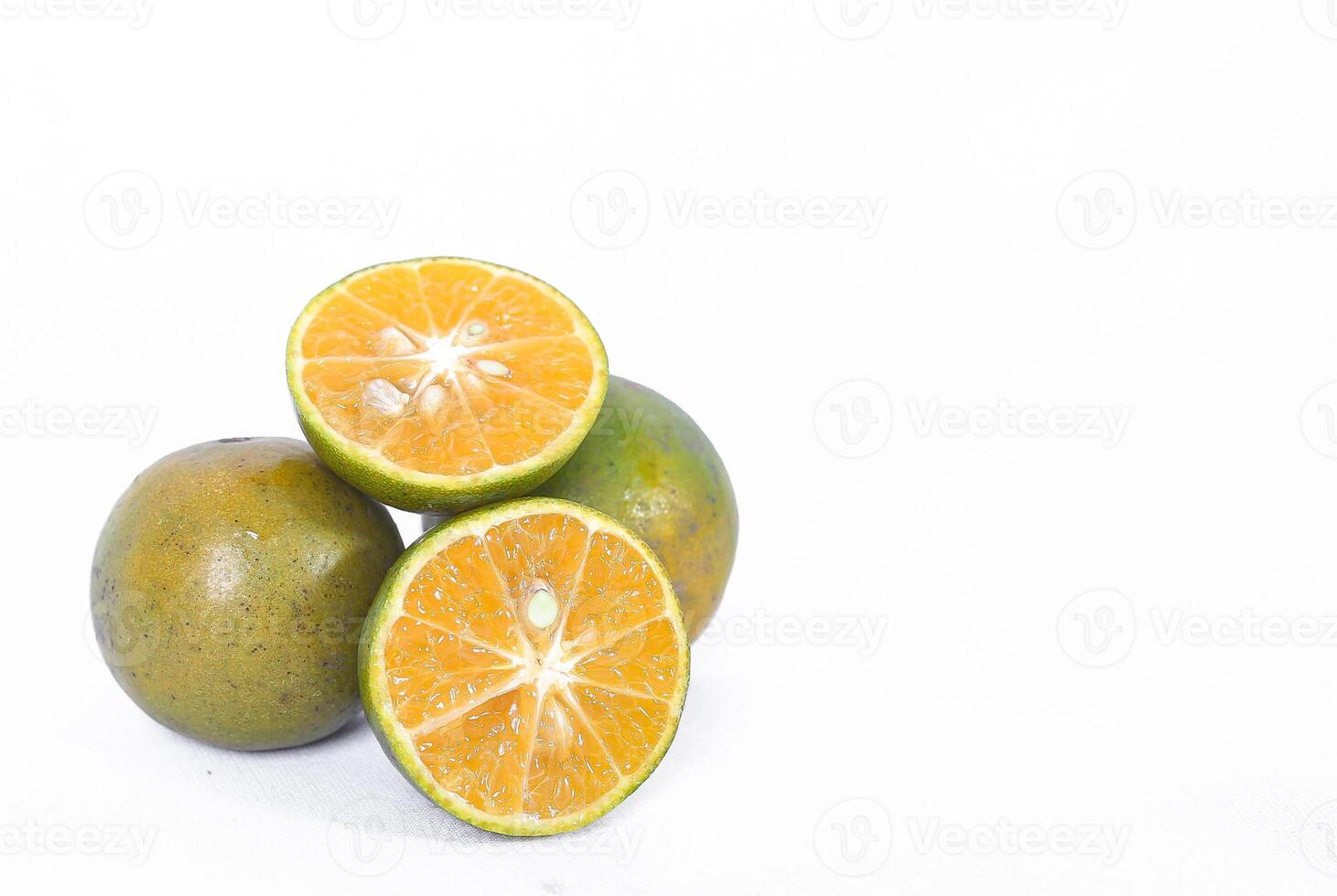 Green orange fruit or Tangerine orange with cut in half isolated on white background. Clipping path photo