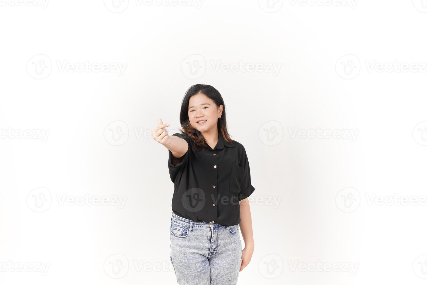 Young Asian woman Showing korean love finger wearing Black t-shirt and jeans isolated on white background photo