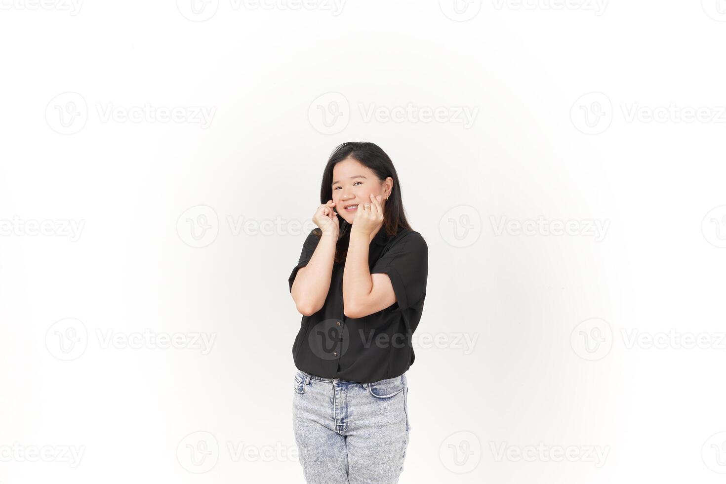 Young Asian woman Showing korean love finger wearing Black t-shirt and jeans isolated on white background photo