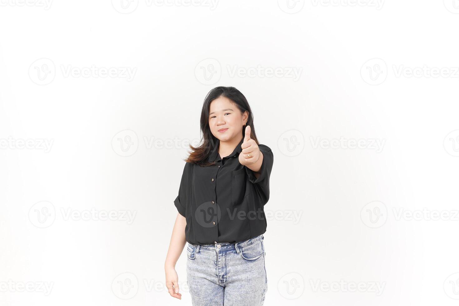 Young Asian woman showing thumbs up, okay or agree concept wearing Black t-shirt and jeans isolated on white background photo