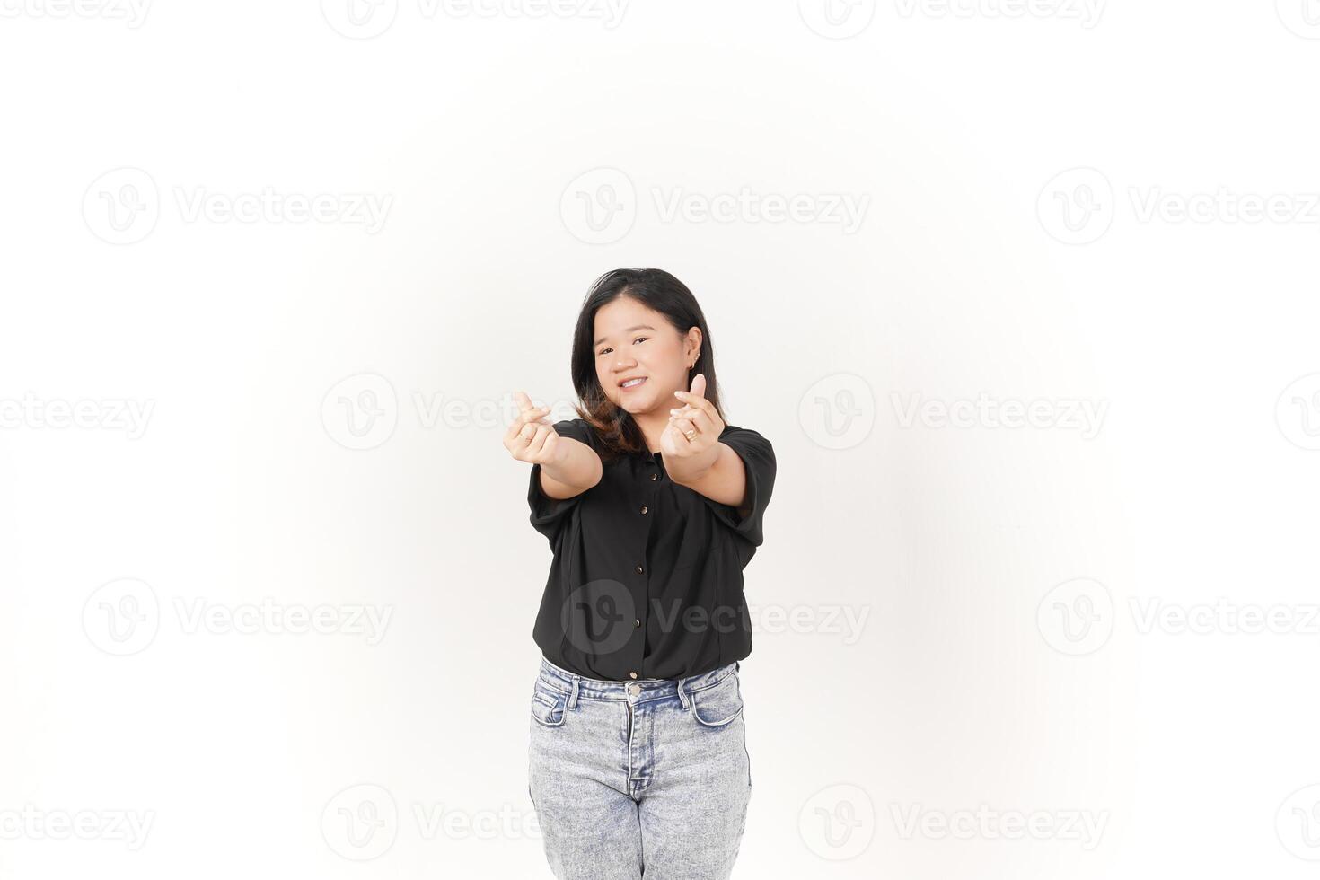 Young Asian woman Showing korean love finger wearing Black t-shirt and jeans isolated on white background photo