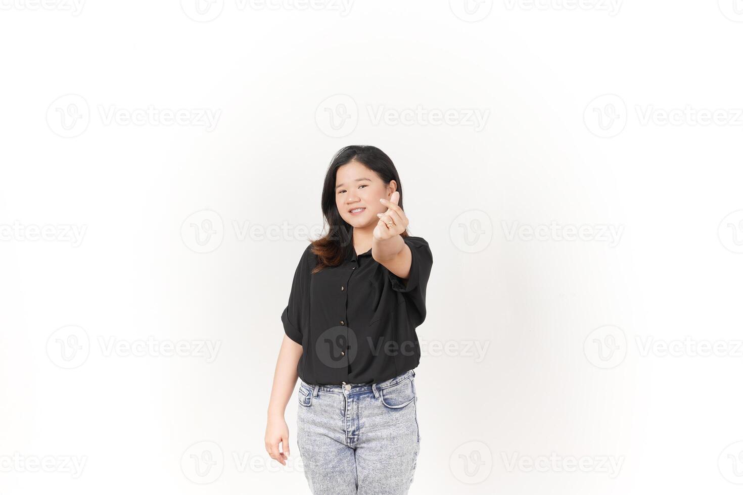 Young Asian woman Showing korean love finger wearing Black t-shirt and jeans isolated on white background photo