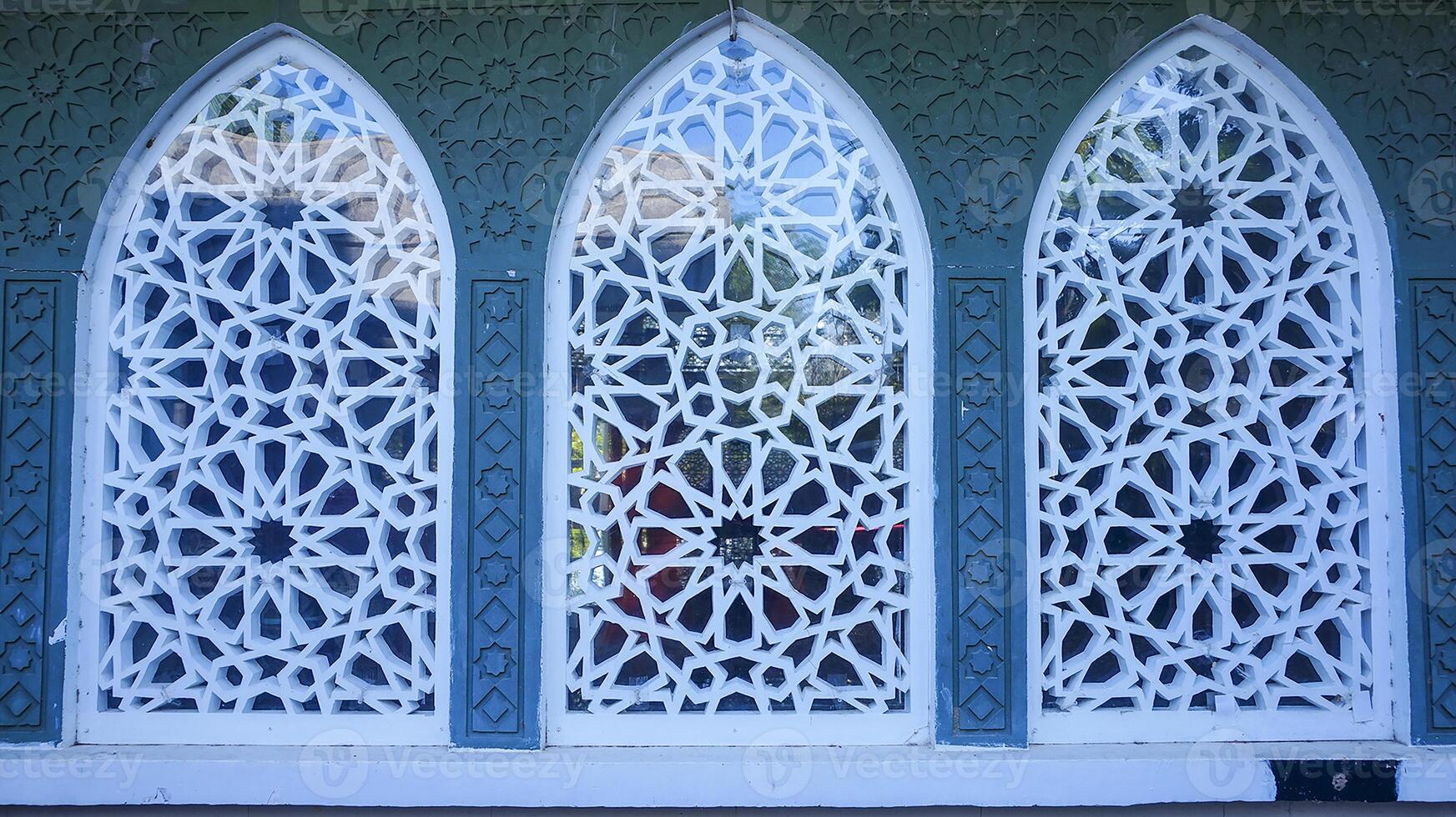 Artistic photo of a mosque wall which has the impression of Islamic religious symbols