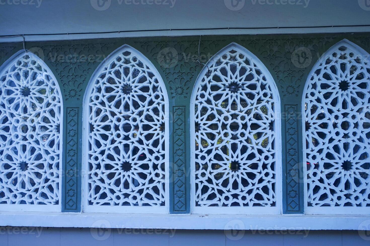 Artistic photo of a mosque wall which has the impression of Islamic religious symbols