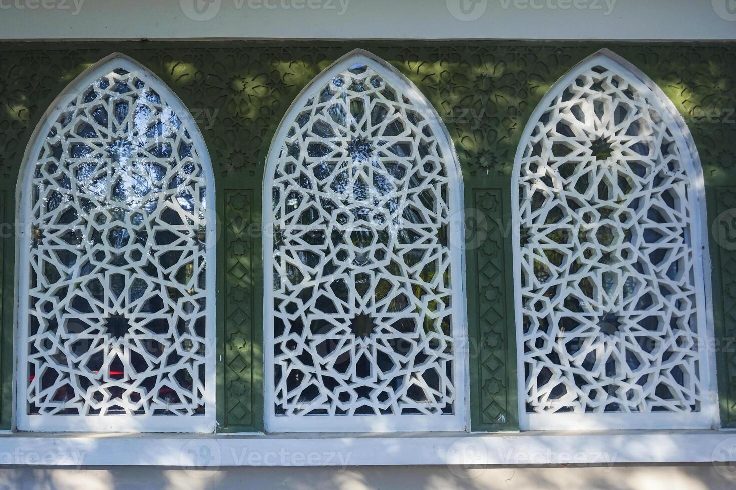 Artistic photo of a mosque wall which has the impression of Islamic religious symbols