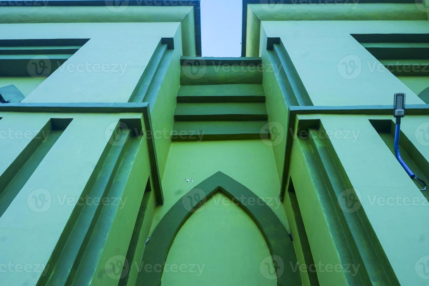 Artistic photo of a mosque wall which has the impression of Islamic religious symbols