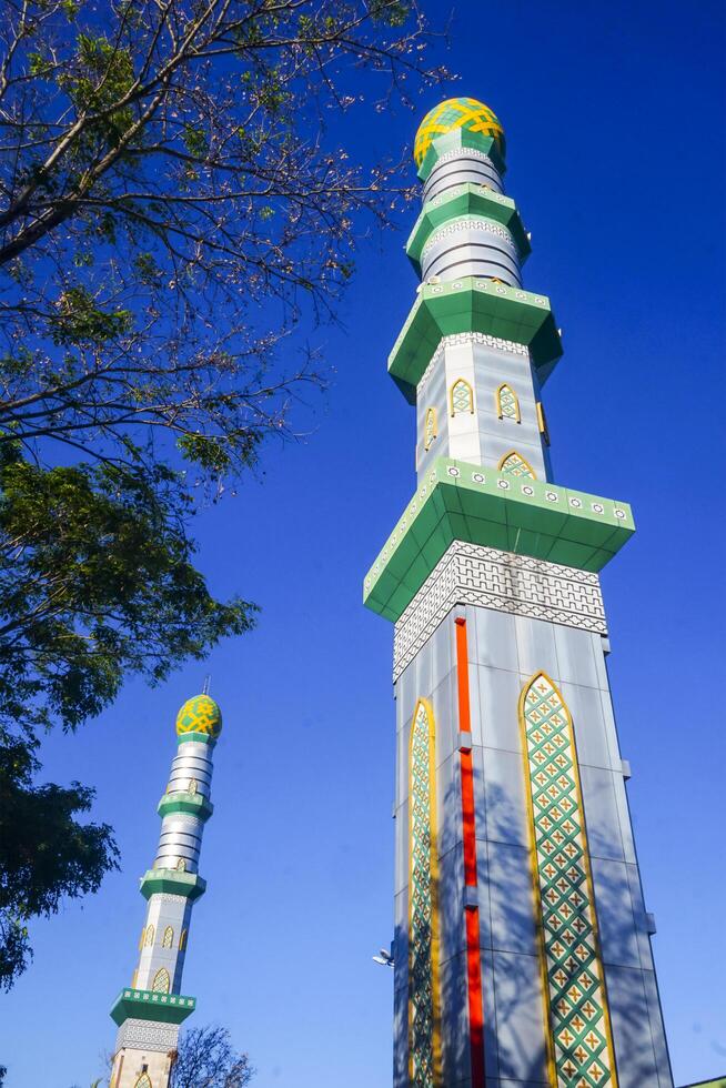 The mosque's minaret rises high against the blue sky, adding to the atmosphere of majesty photo