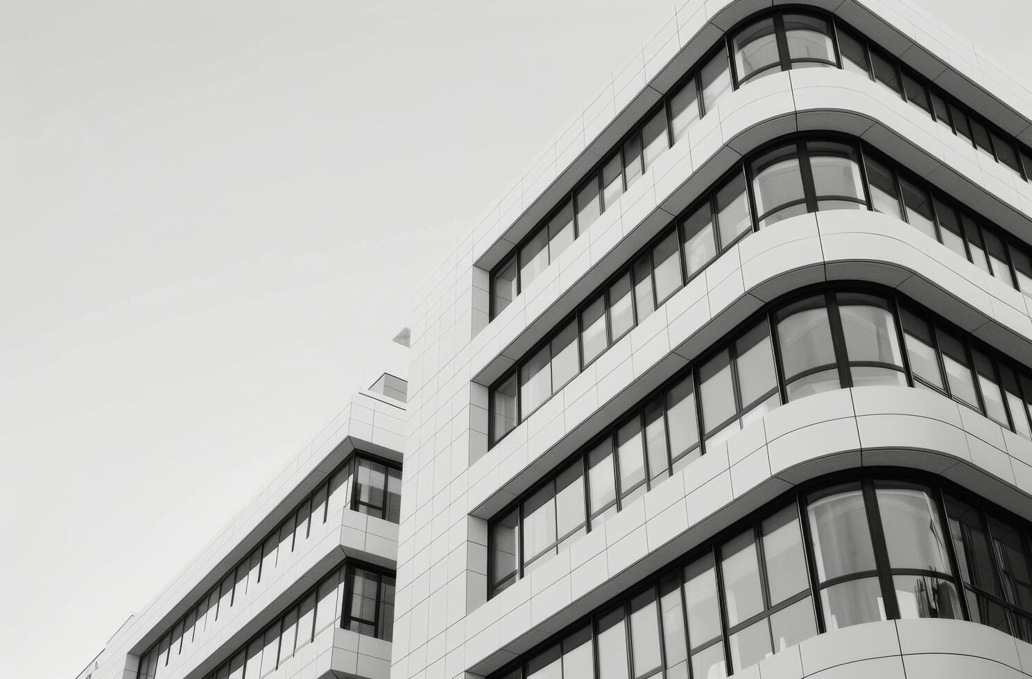 Modern Architectural Building With Sleek Lines and Large Windows in Urban Setting photo