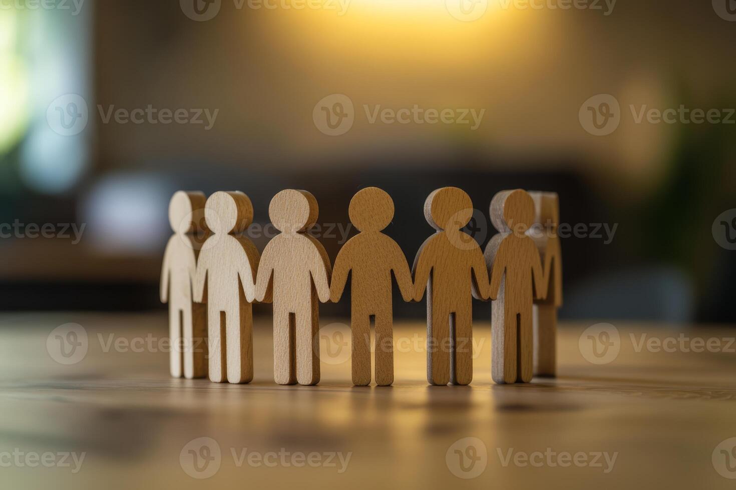 A captivating circle of intricately designed wooden human figures symbolizes teamwork, unity, and community, showcasing collaboration and meaningful connections that foster belonging photo