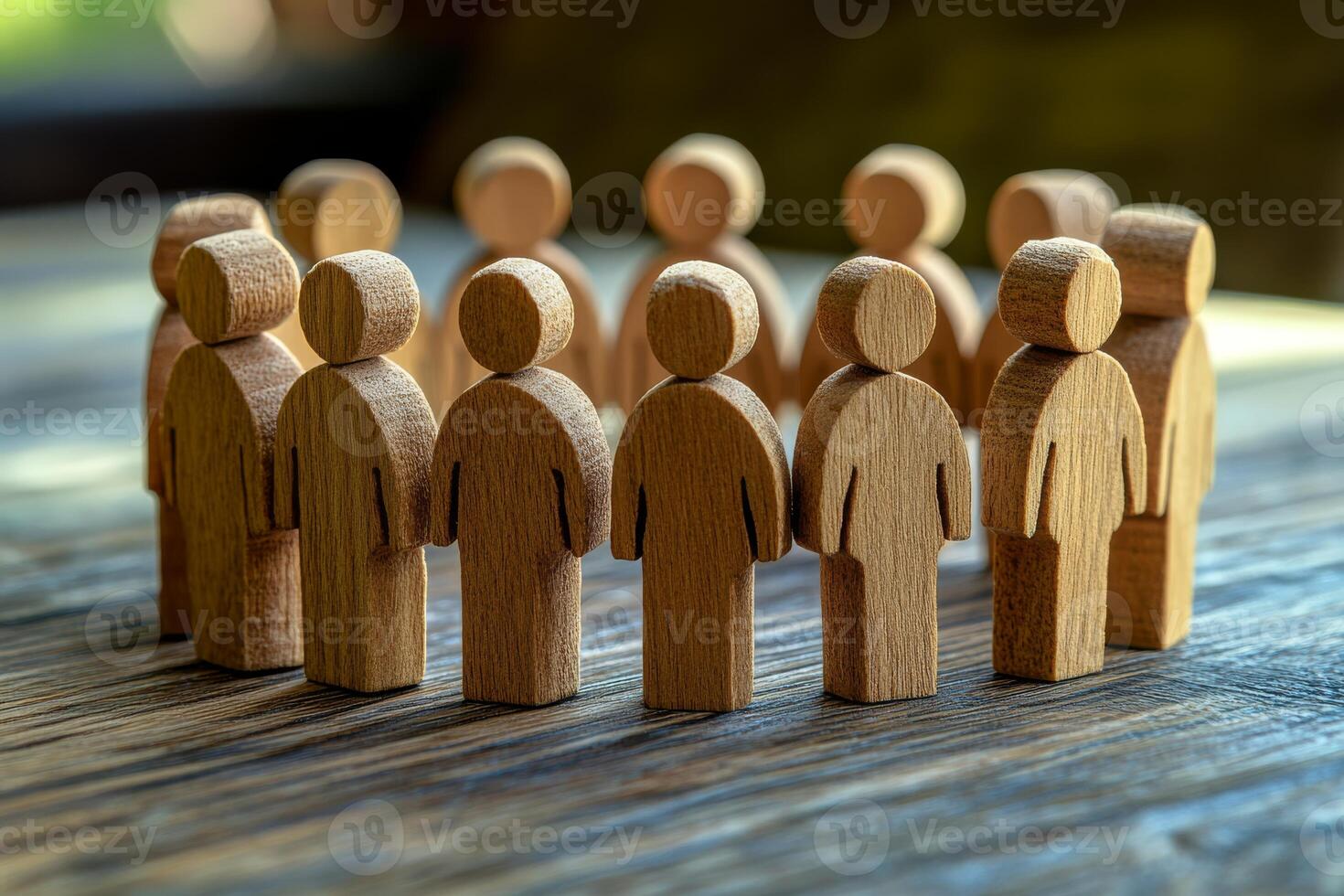 A crafted circle of interlinked wooden figures represents unity, teamwork, and community spirit, highlighting the importance of collaboration and genuine connections among individuals photo
