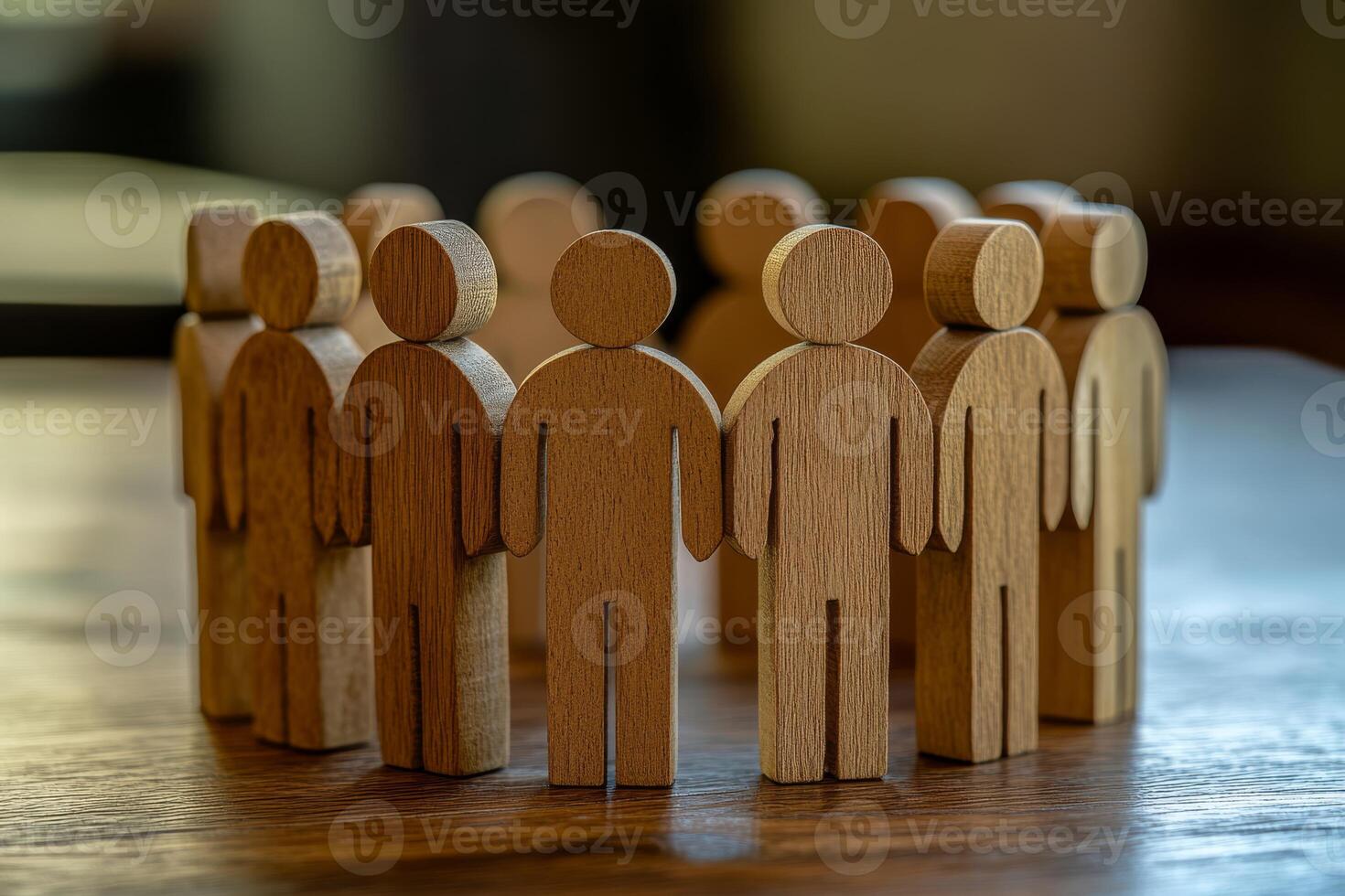A vibrant circle of intricately carved wooden figures symbolizes teamwork, unity, and the strength that comes from community collaboration and togetherness we all cherish in our lives photo