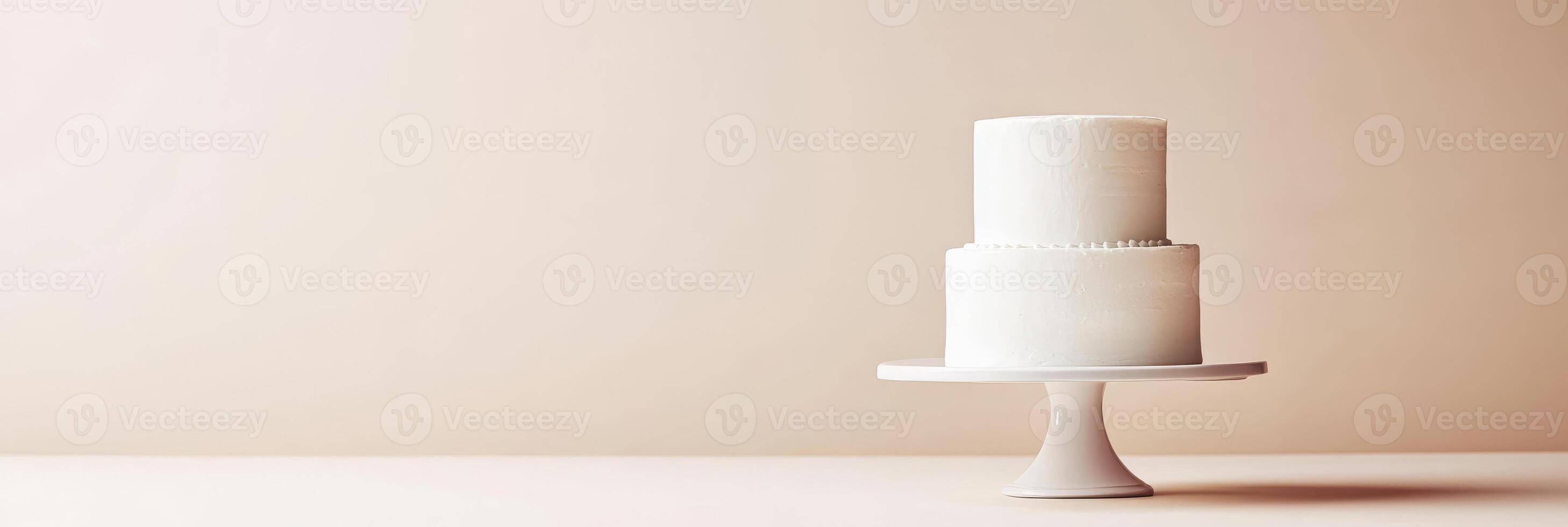 A beautifully minimalistic white birthday cake is elegantly displayed atop a simple yet charming cake stand, making it perfect for any kind of celebration or special occasion that you may have photo