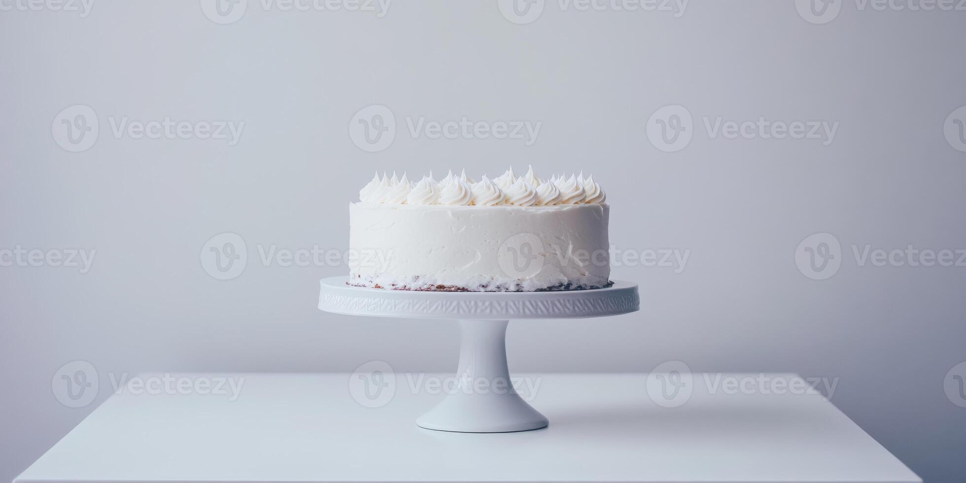 A beautifully crafted and simplistic white birthday cake elegantly presented atop a cake stand, making it an ideal choice for any celebration, characterized by its clean and minimalistic design photo