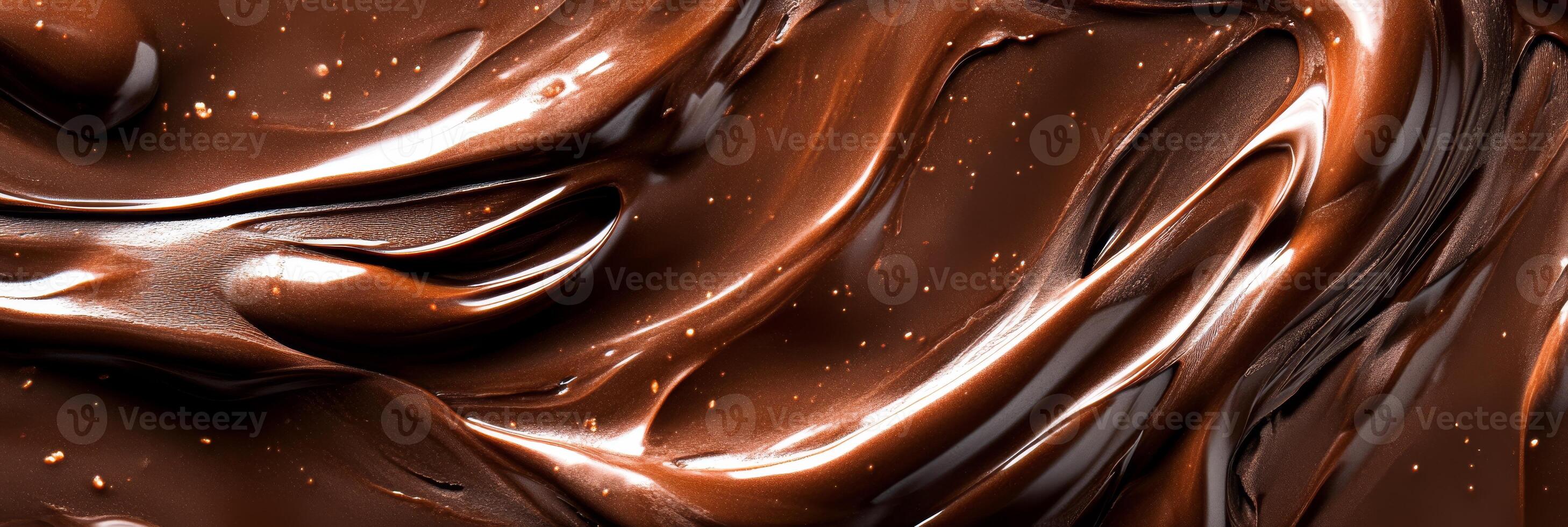 This visually appealing image showcases a silky melted chocolate swirl, emphasizing its rich texture, making it an irresistible addition to various delectable desserts and confections photo
