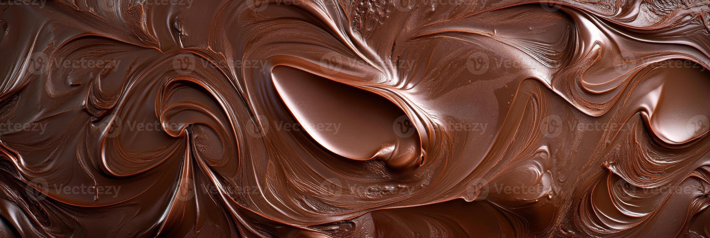Luxurious melted chocolate transforms into a wonderfully smooth, swirled texture, making it an ideal ingredient for an array of desserts and culinary delights that excite the senses photo
