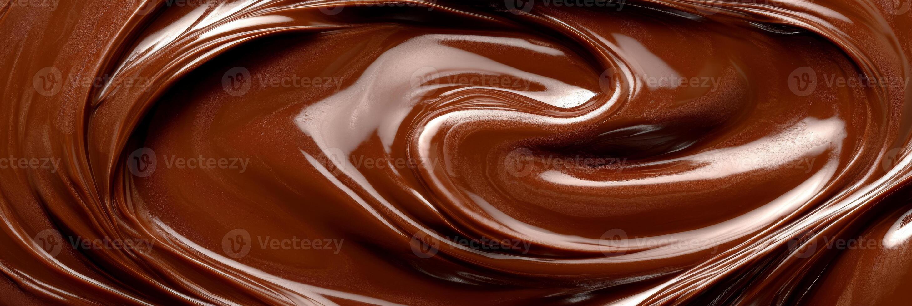 A rich and glossy image of melted chocolate, displaying a smooth and creamy swirl texture that is absolutely perfect for desserts, gourmet recipes, and endless culinary inspiration photo