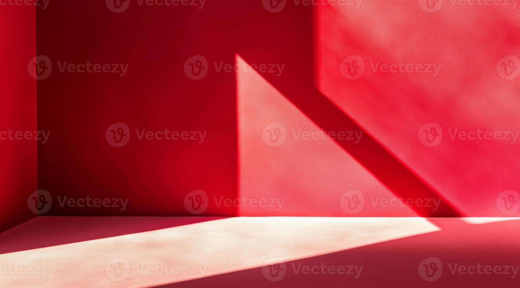 The vibrant red walls, combined with striking shadows, beautifully create an abstract and dynamic interior space photo