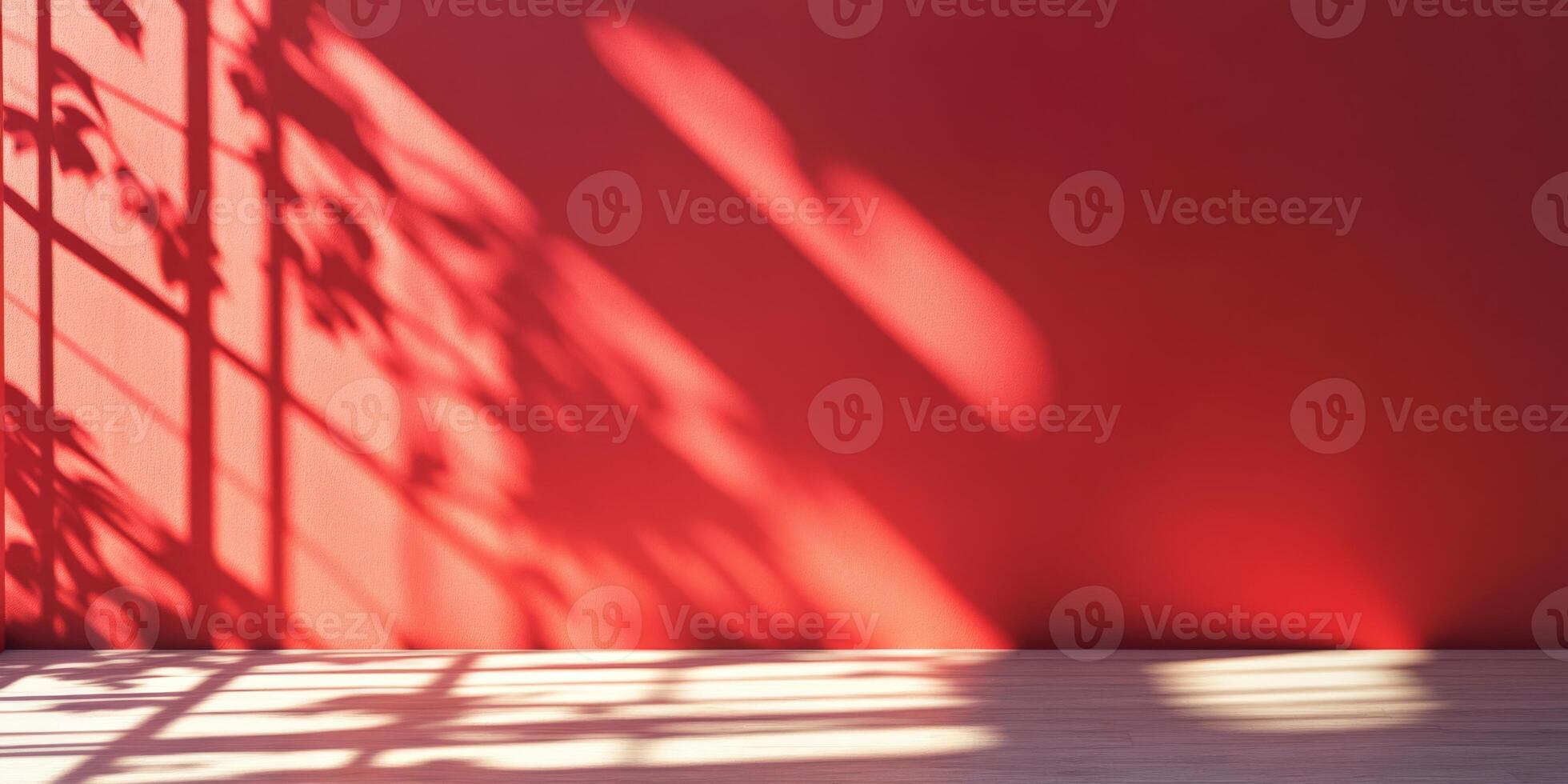 A beautifully serene capture that elegantly showcases the shadows casting beautifully on a vibrant red wall photo