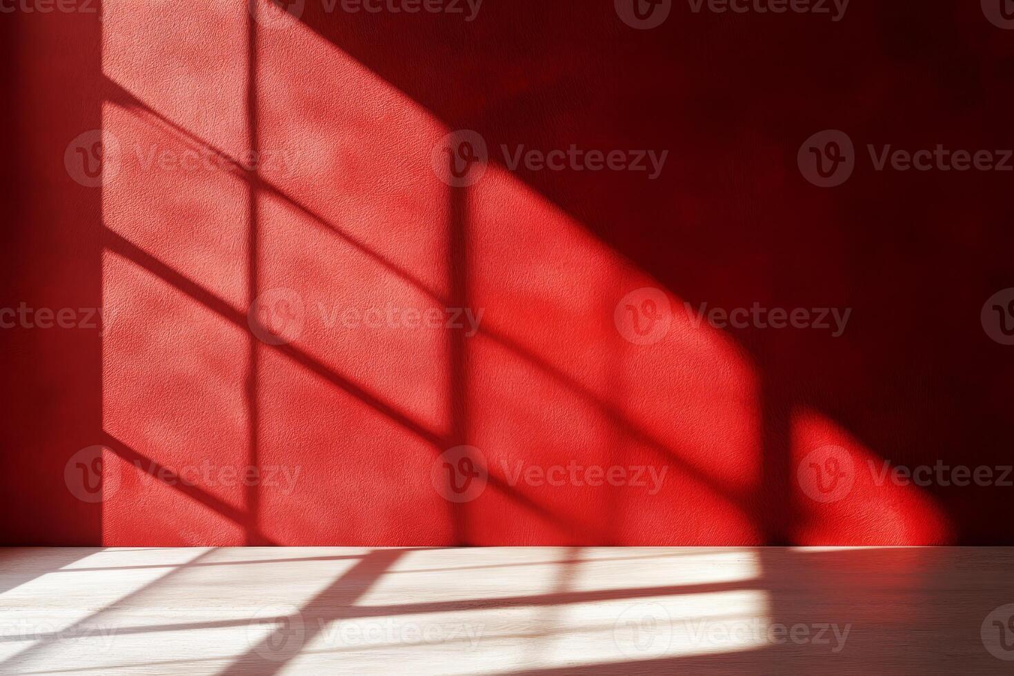 Artistic shadows beautifully cast on a vibrant, bold red wall, capturing the interplay of light and color photo