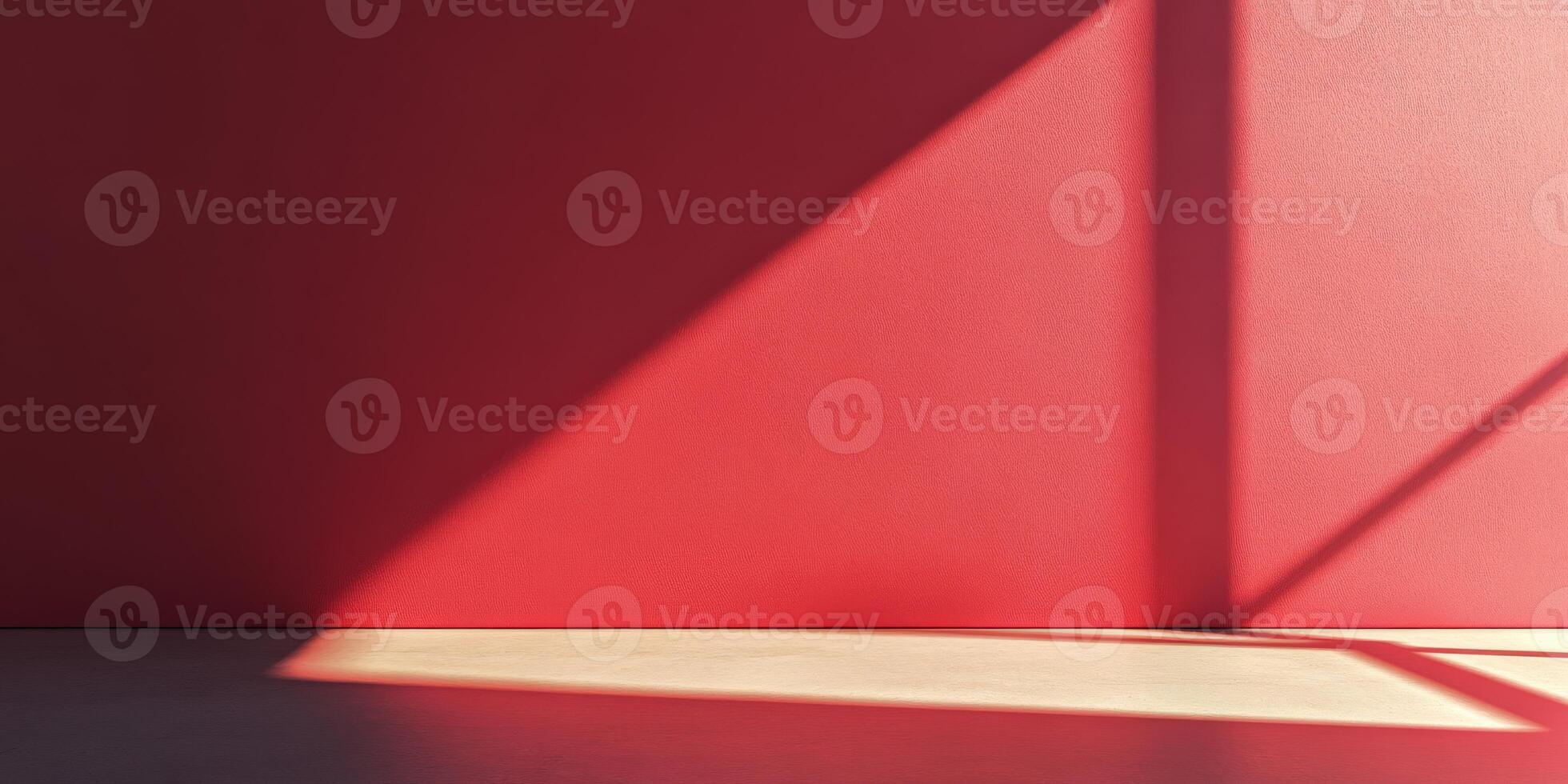 A strikingly bold red wall casting angular shadows that evoke modern design aesthetics and creativity photo