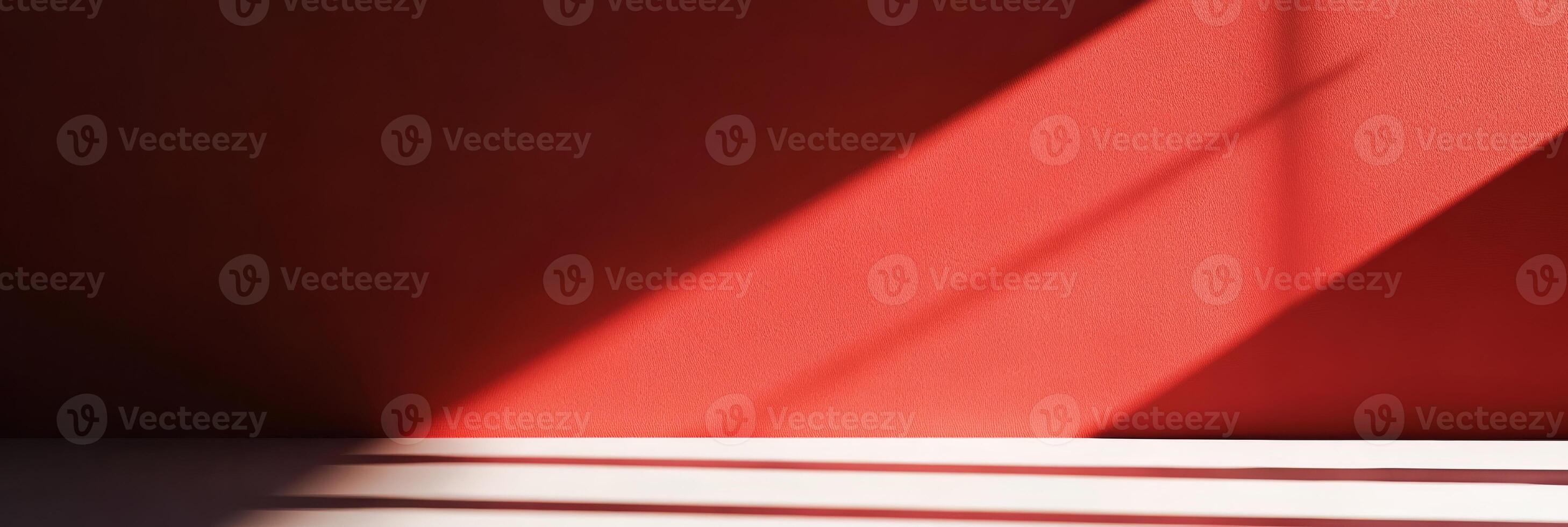 An abstract play of shadows and light dances on a bold red wall, creating captivating visual interest and allure photo