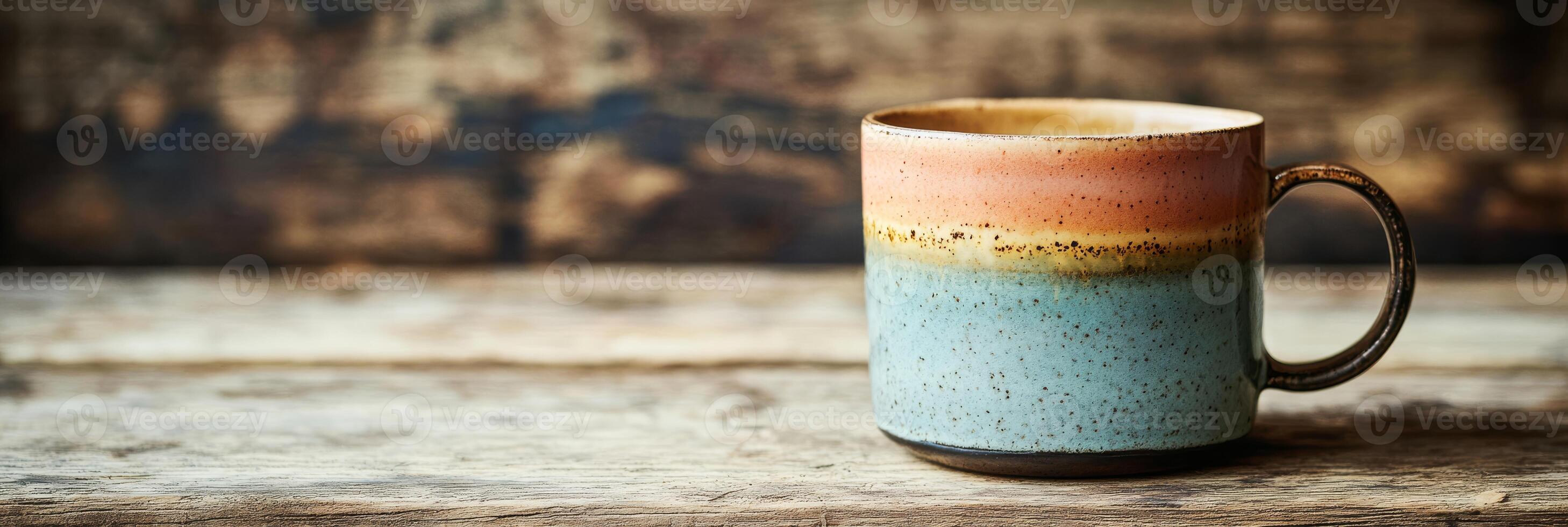 This exquisitely crafted ceramic coffee cup showcases a stunning blend of earthy colors, making it the perfect choice for indulging in your favorite beverages with a touch of style and elegance photo