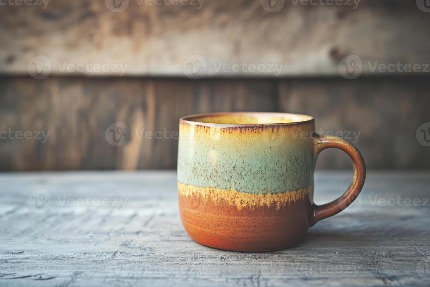 This is a beautifully crafted ceramic coffee cup that showcases stunning earthy tones of green and brown, making it the ideal choice for enjoying your favorite hot and cold beverages with style photo