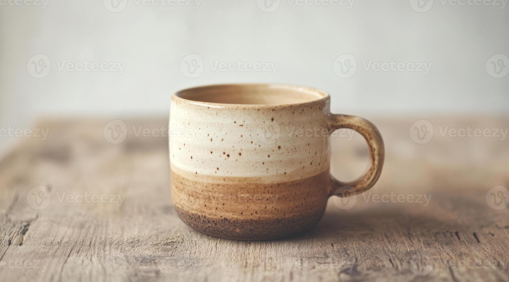 This beautifully crafted ceramic coffee cup boasts a unique design with earthy tones and a rustic yet elegant aesthetic, making it perfect for enjoying your morning brew or sipping on cozy evenings photo