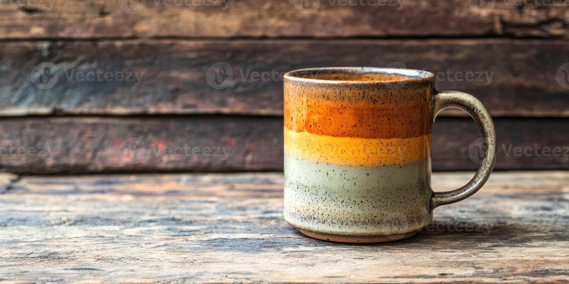 This elegantly crafted ceramic coffee cup showcases a delightful array of warm earthy tones, making it the ideal choice for savoring your favorite hot or cold beverages at any time of the day photo