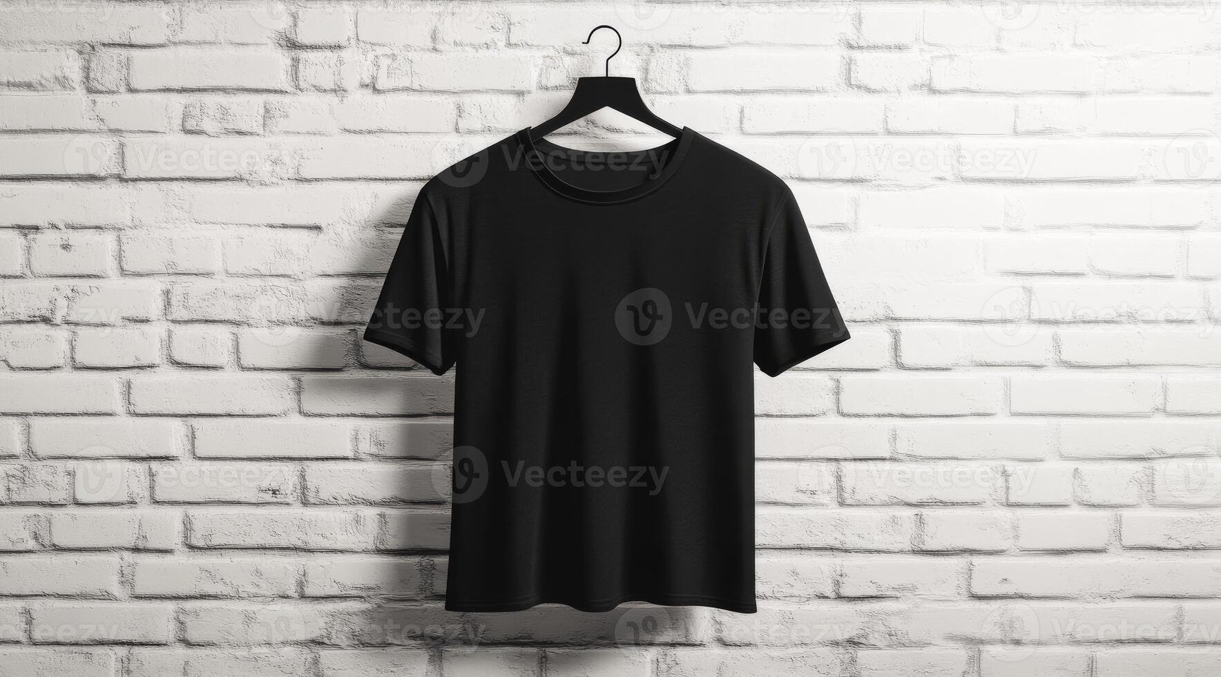 A sleek and stylish black tshirt gracefully hangs on a hanger, set against a pristine white brick wall photo