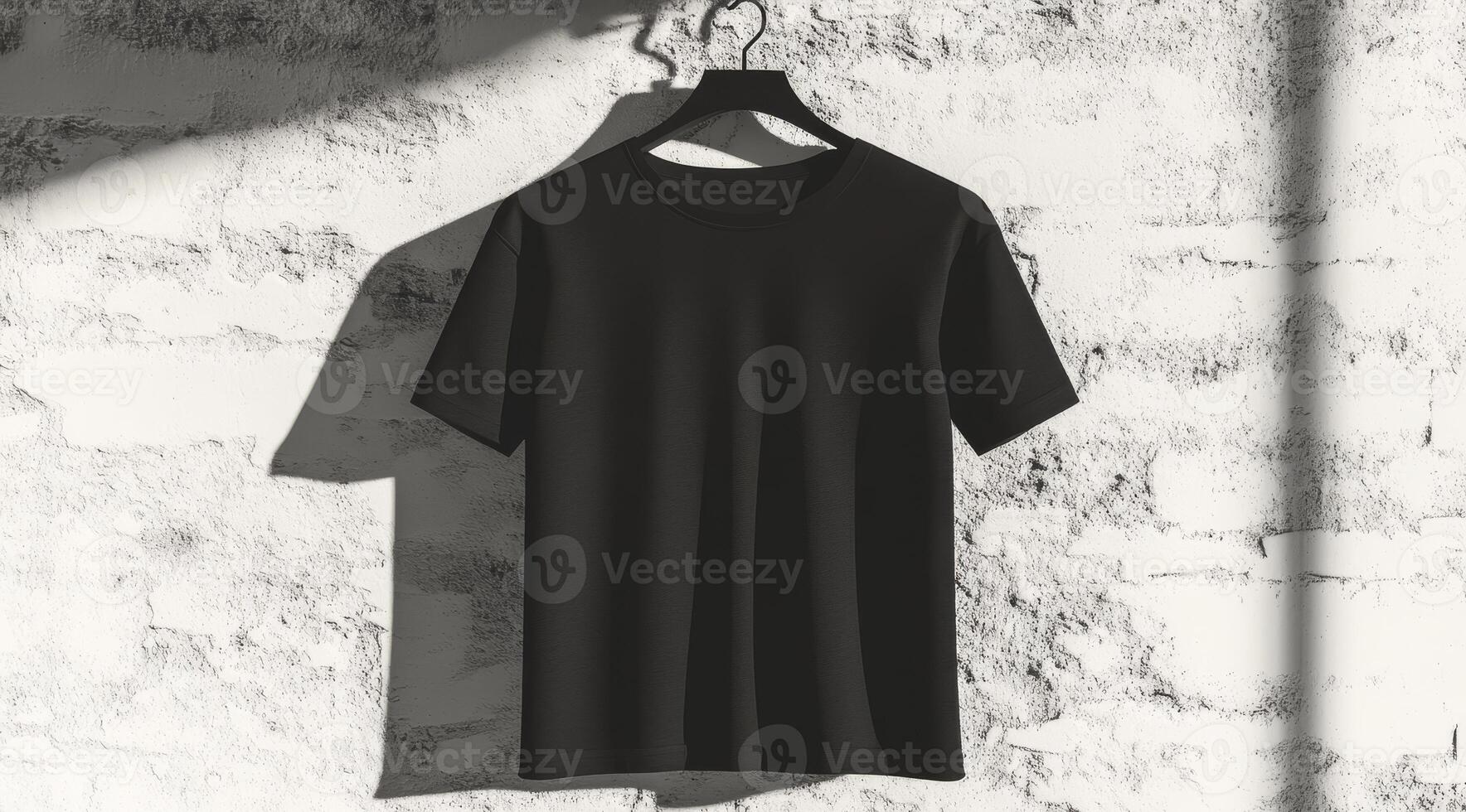 A stylish minimalist black tshirt elegantly displayed on a hanger against a beautifully textured wall background photo