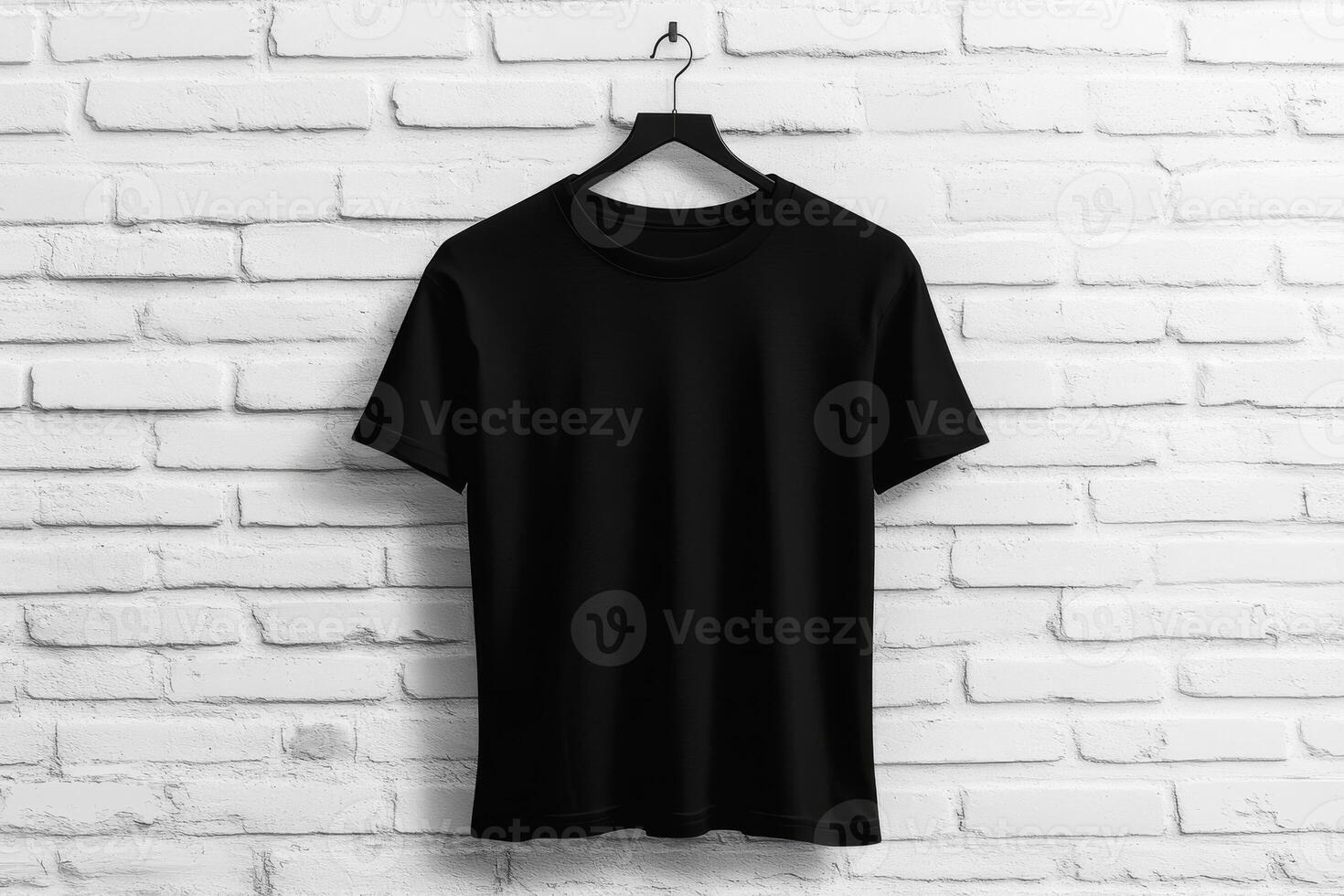 A minimalist black tshirt is elegantly displayed on a hanger against a stylish and modern white brick background photo
