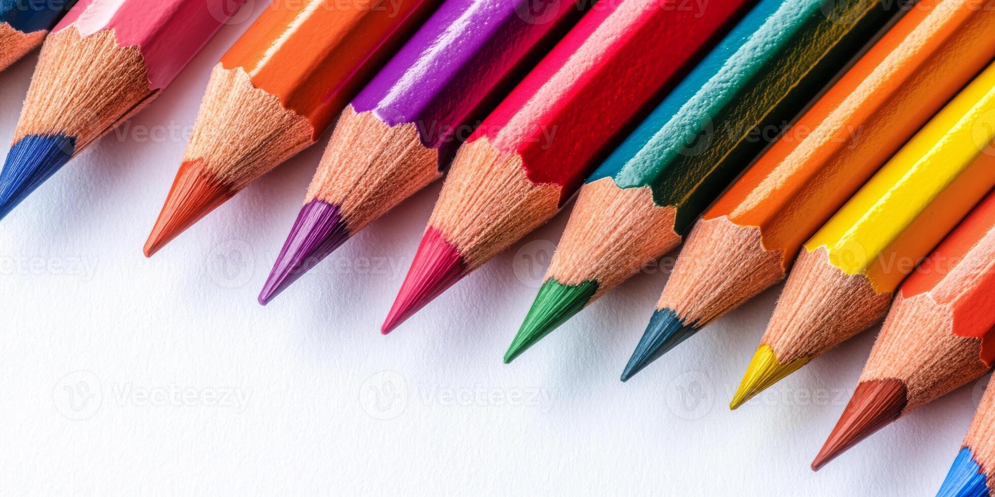 A vibrant and colorful array of colored pencils is fully prepared for artistic expression and creativity photo