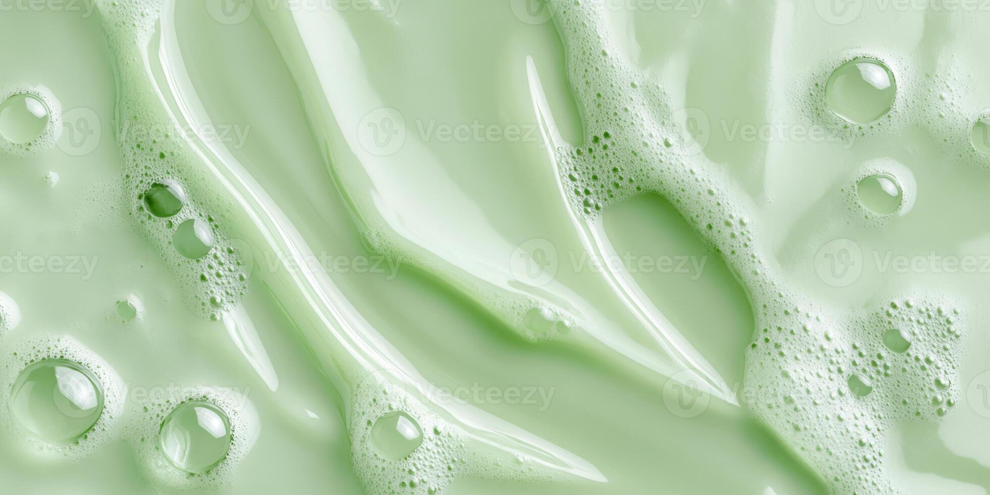 This macro view highlights a green cosmetic serum, showcasing its smooth texture, delicate bubbles, and selected natural ingredients, emphasizing key themes of health and wellness photo