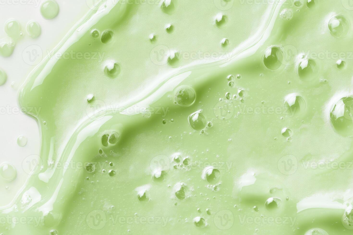 This image presents a macro view of a green serum, vividly showcasing its smooth, luxurious texture along with tiny bubbles that embody the essence of natural skincare and its benefits for the skin photo