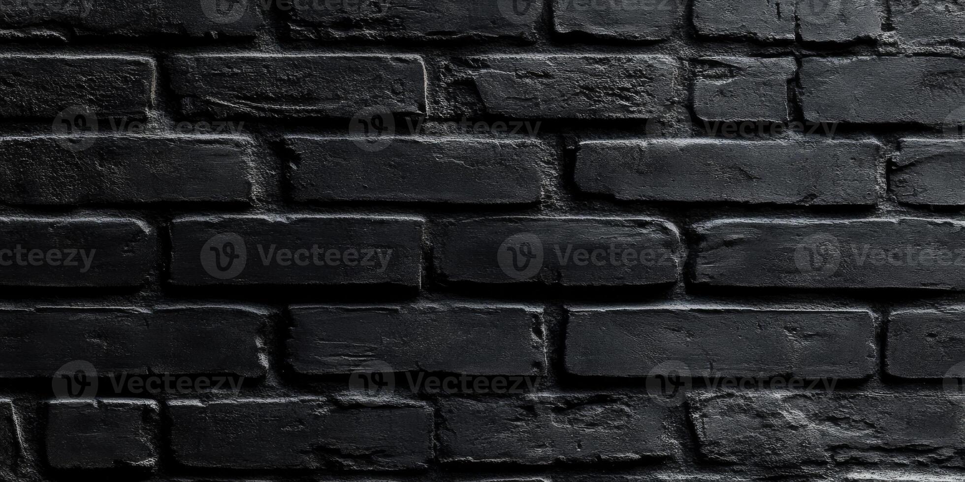 This image features a closeup of a striking black brick wall, highlighting its textured surface and sleek monochrome look, perfect for various creative design and architecture projects photo