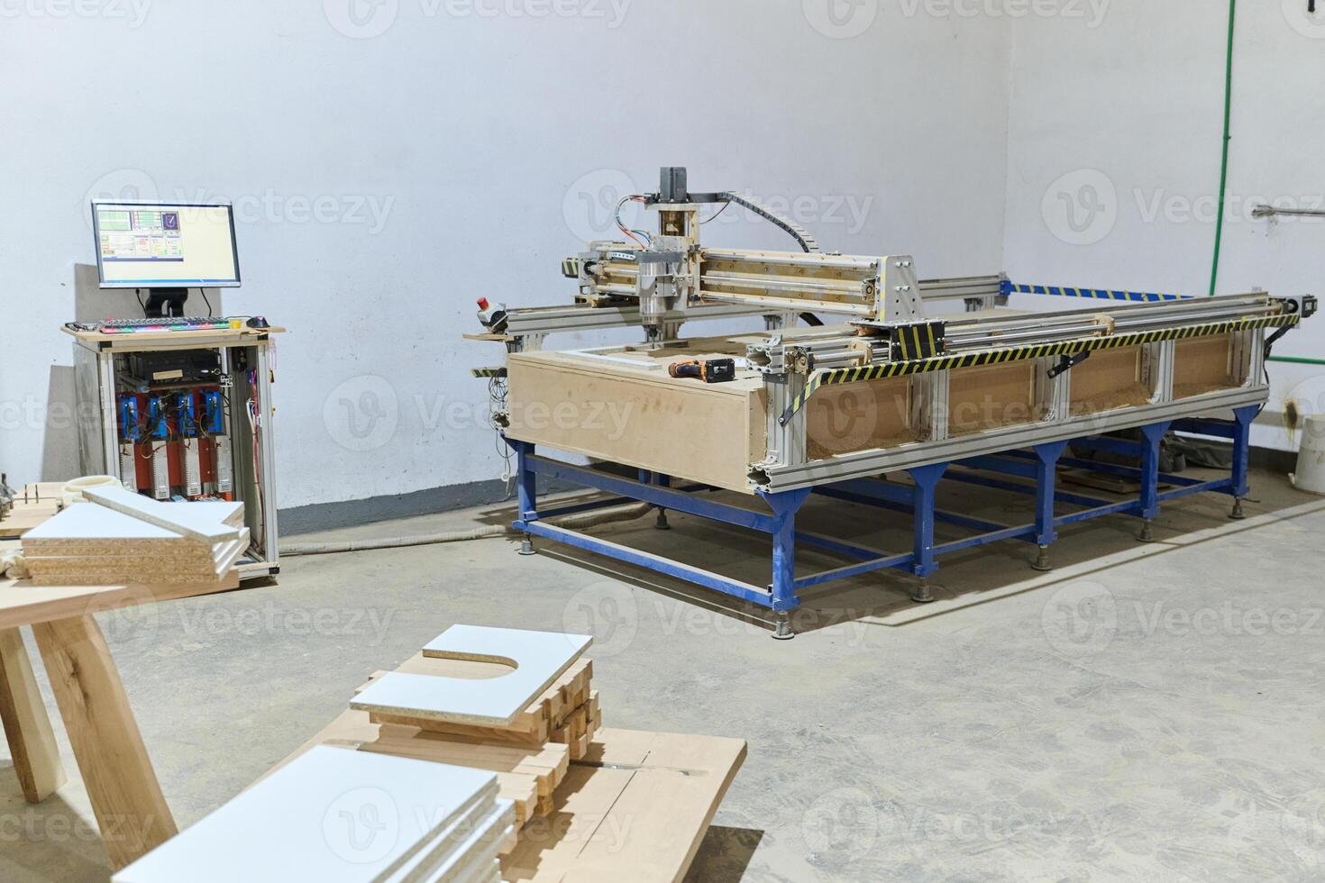 Interior of Wood Processing Industry Featuring CNC Cutting Machines and Wood Processing Equipment photo