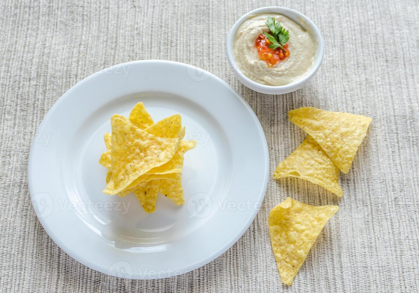 Corn chips with hummus photo