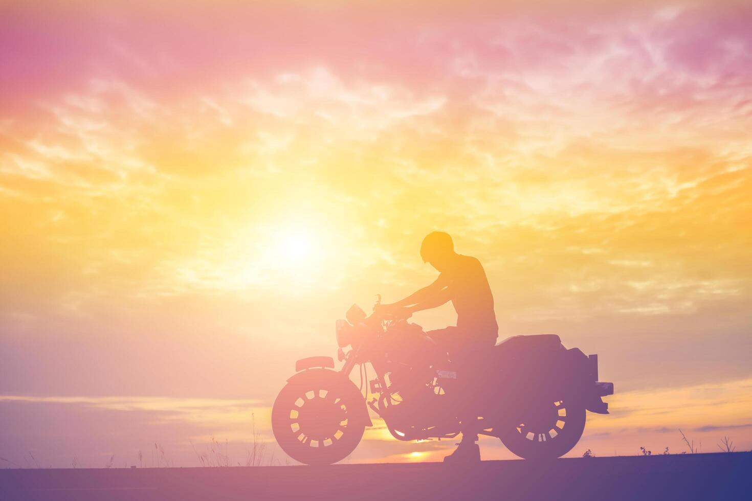 Man biker over sunset photo