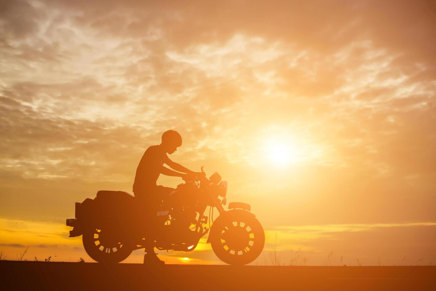 Man biker over sunset photo