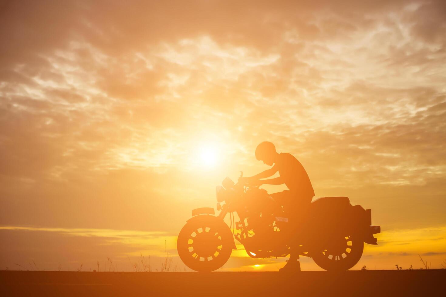 Man biker over sunset photo