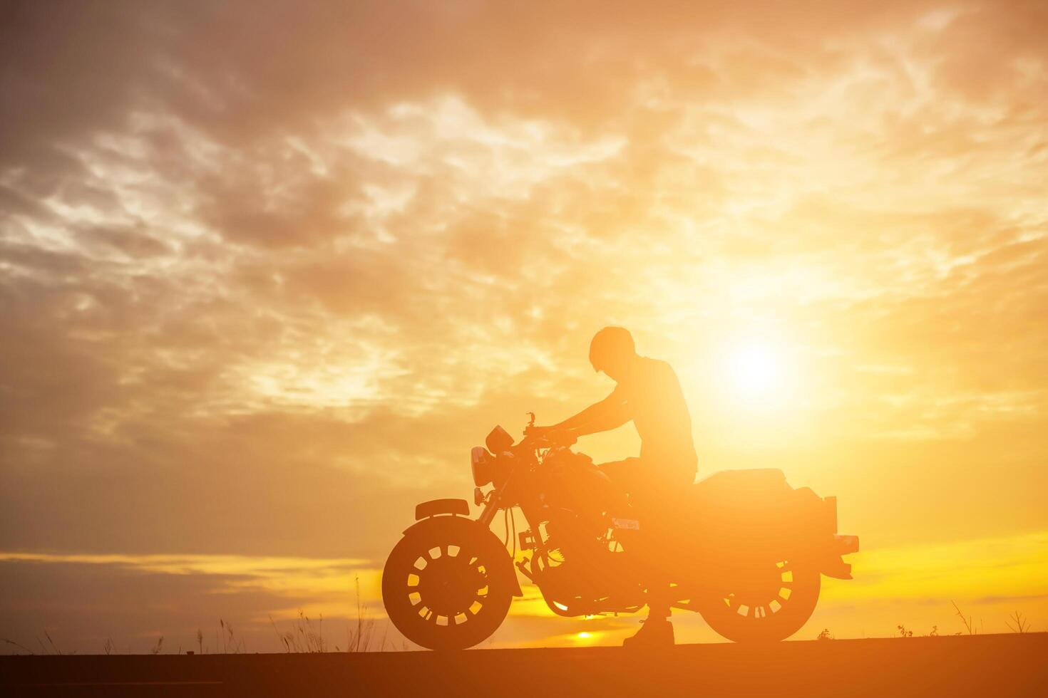 Man biker over sunset photo